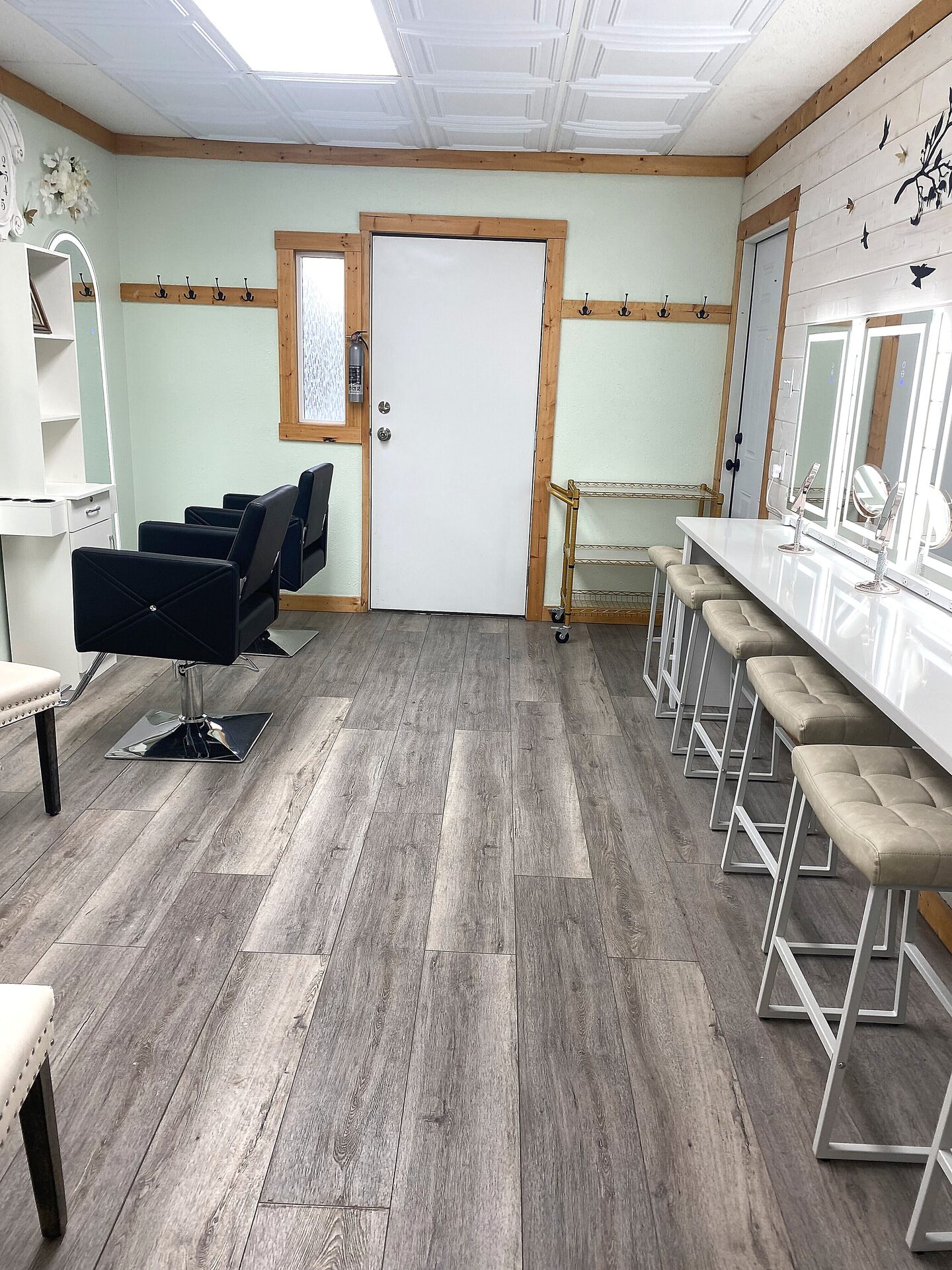 Full room view of the Bride's Room at Sandy River Airport showing salon stations and vanity counter with LED mirrors